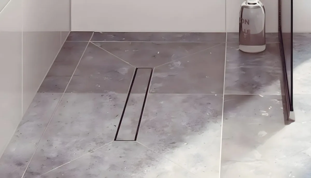 Wet room floor former with a linear drainage channel