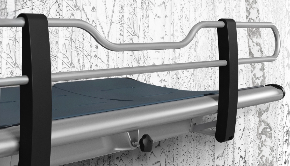 Pressalit fixed height wall mounted shower changing table