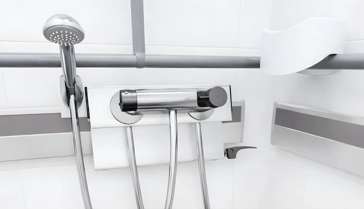 Pressalit PLUS horizontal wall track with accessible bathroom storage accessories