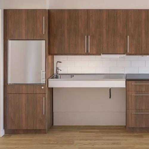 Granberg Manulift 6350 height adjustable kitchen worktop configured with sink and cooking area