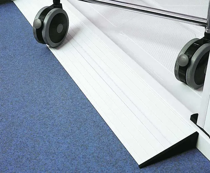Low-profile aluminium access ramp fitted to an AKW Braddan shower tray