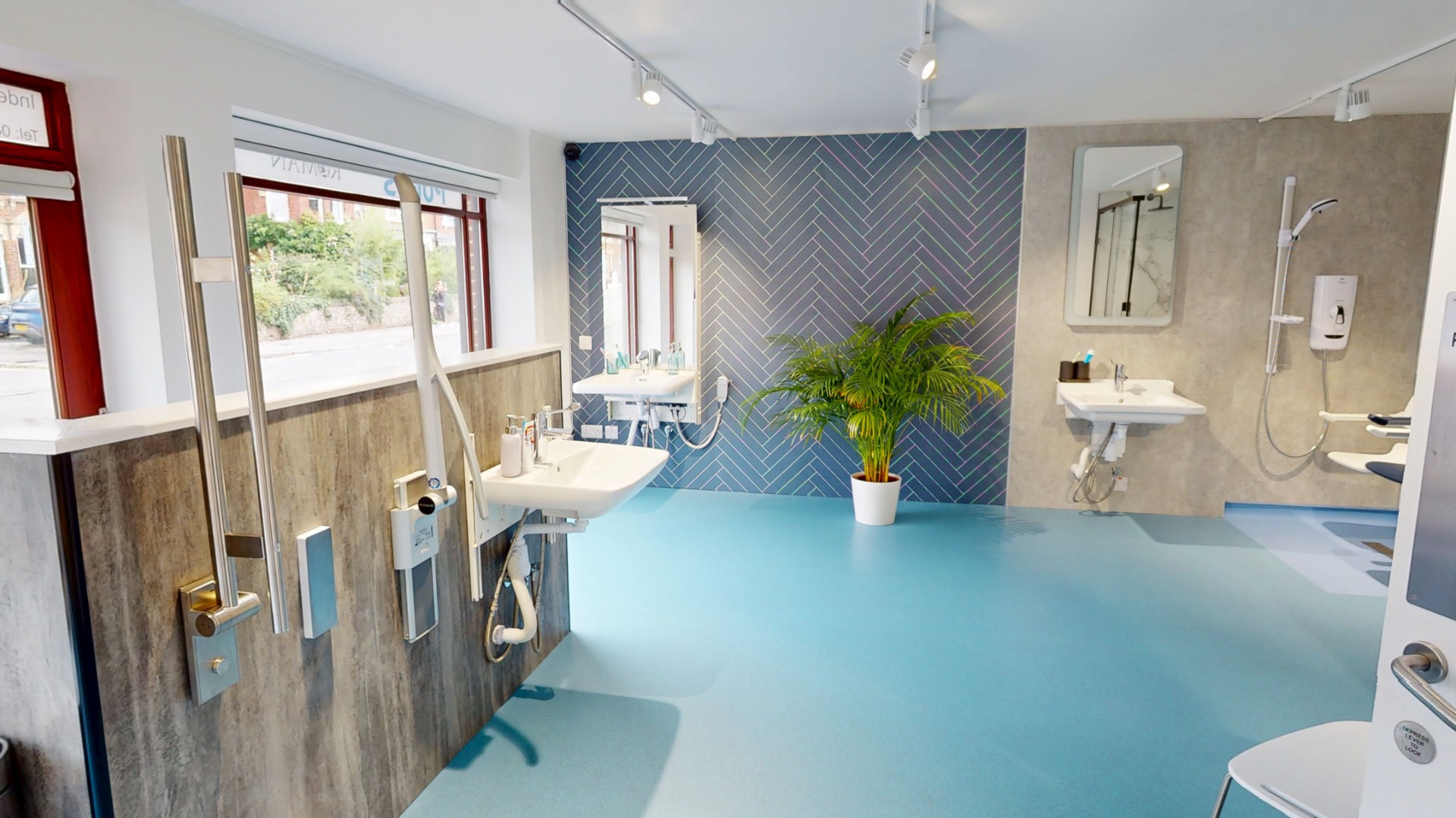 Independent 4 Life bathroom showroom with working height-adjustable washbasins and support rails