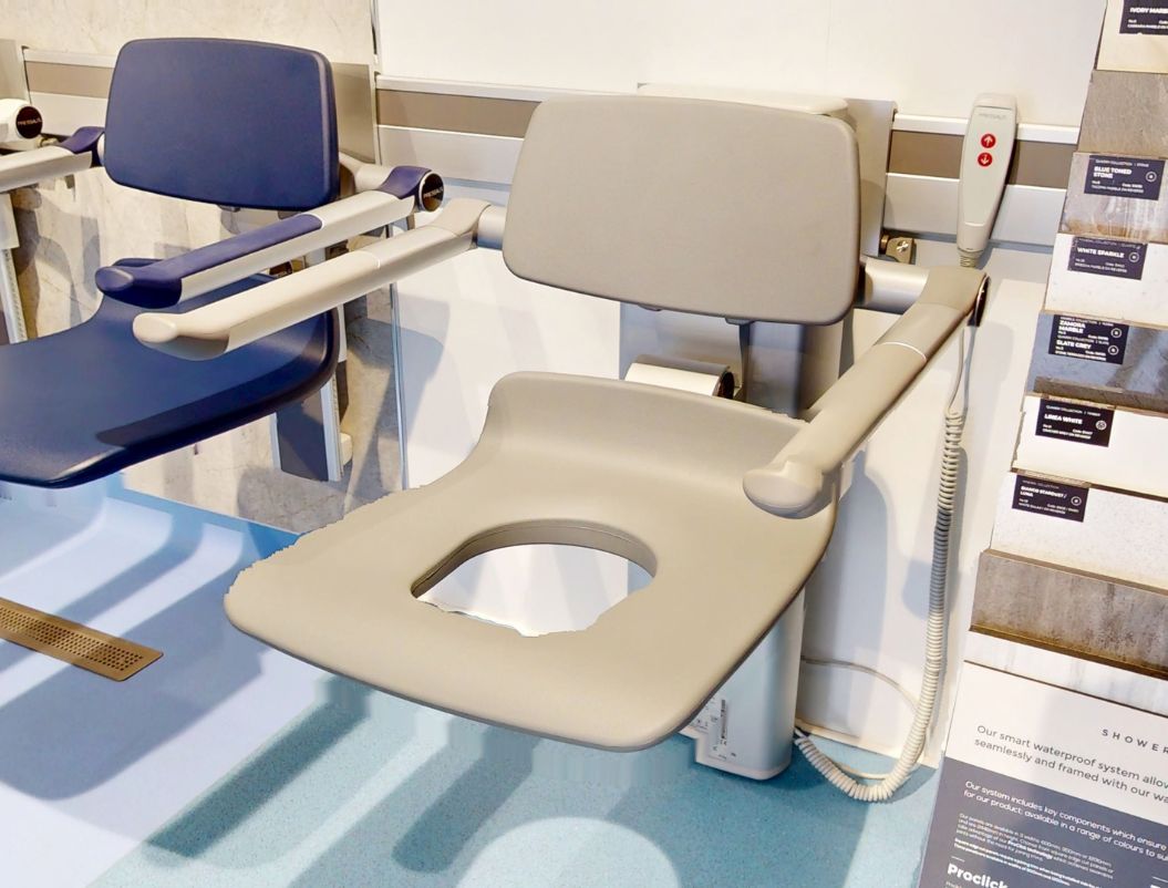Pressalit PLUS electric aperture shower seat