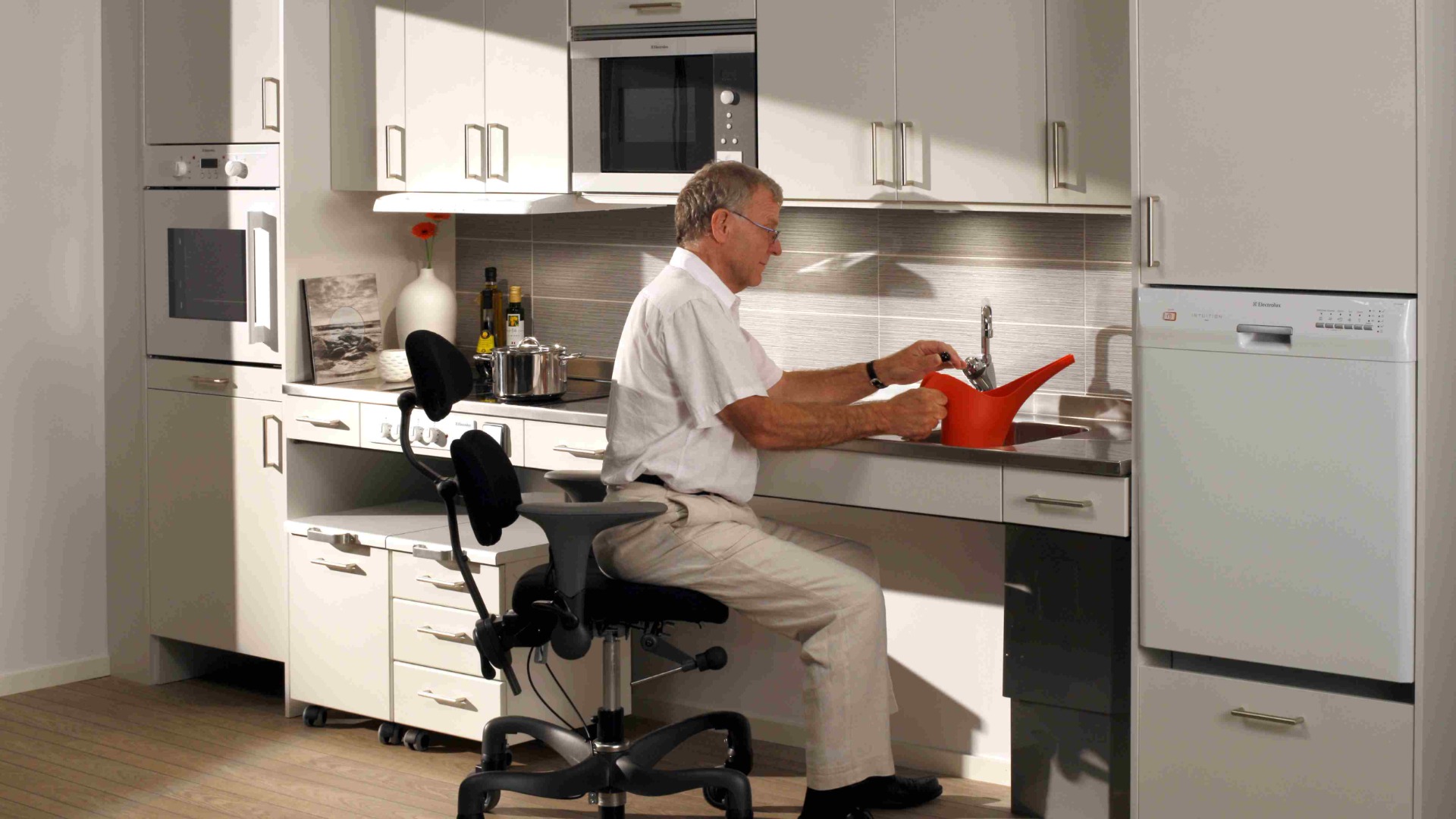 Professionals planning an accessible kitchen and bathroom project
