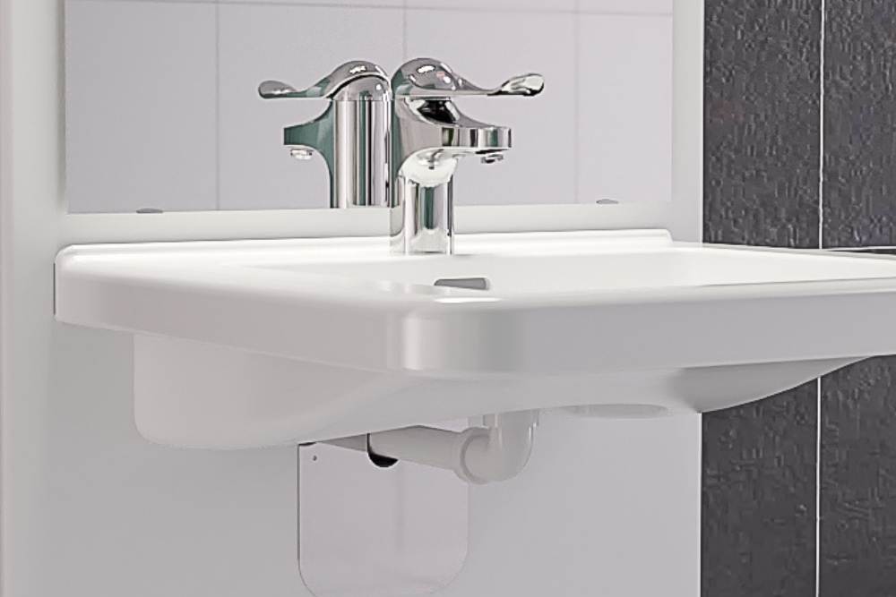 Accessible long lever bathroom tap on an ergonomic washbasin