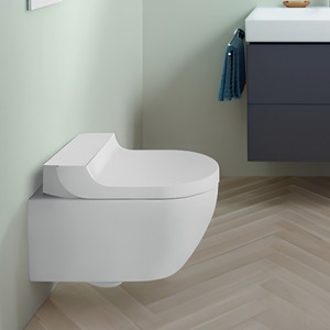 Electronic bidet toilet seat fitted to a WC pan