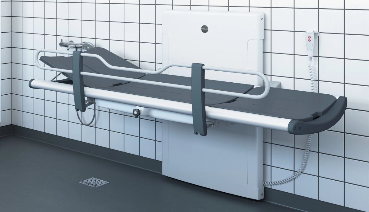 Pressalit shower changing table installed in an accessible changing environment