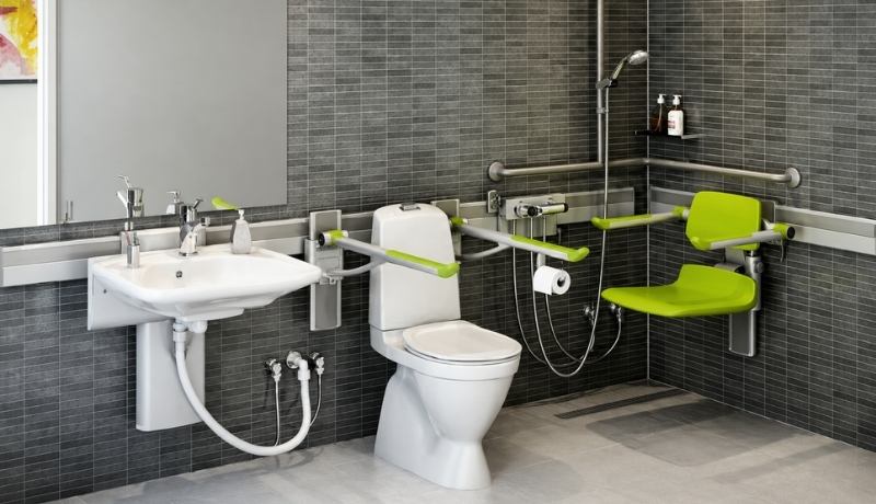 Pressalit PLUS shower seat fitted to an adjustable wall track