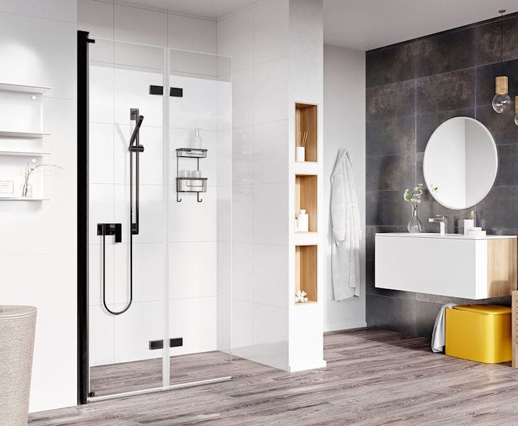 Full-height bi-folding glass shower enclosure with chrome frame