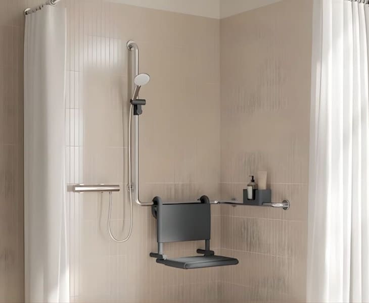 White hanging shower seat fitted onto accessible bathroom wall rails