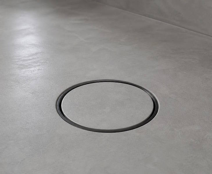 Round microcement flooring grids in four frame finishes