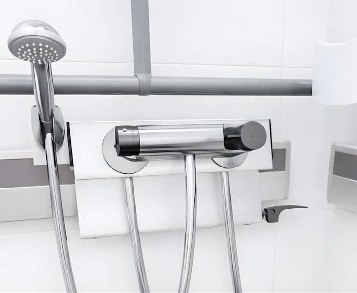 Pressalit PLUS wall tracks with removable bathroom storage baskets and accessories