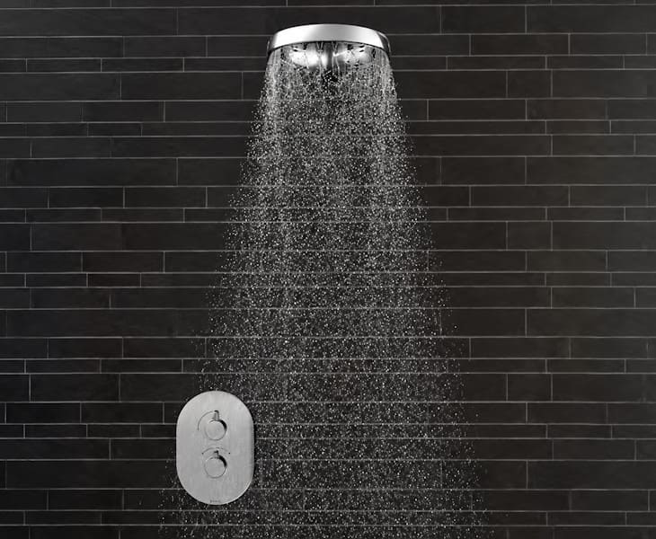 Rain shower head providing a wide spray for comfortable bathroom showering